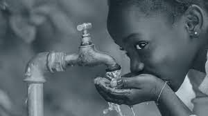 kid taking tap water